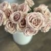 12 fresh cut roses of your color choice delicately prepared for your