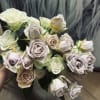 24 freshly cut Spray Roses of your color choice delicately arranged into