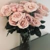24 fresh cut roses of your color choice delicately arranged in a
