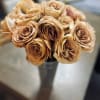 24 roses of your color choice delicately arranged in a sturdy, metal