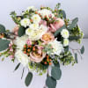 This beautiful hand tied bouquet was created using roses, ranunculus, stock, hypericum
