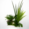 A stunning arrangement that features succulents, long living foliage then topped off