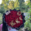 50 roses wrapped with a crown and butterflies 

Rose color available:
Red 
Pink
Hot