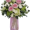 Nothing looks quite as fresh as soft pink roses among bright green