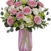 Nothing looks quite as fresh as soft pink roses among bright green