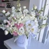 White box with pastels color flowers 
Standard size same as pictured. Container