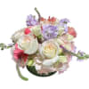 Description:
Easter Harmony pastel bland of seasonal blooms is in low shape floral