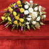 Half casket cover arrangement of white roses, hybrid lilies, football mums, monte