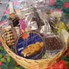 Beautiful medium basket filled with gourmet goodies, chocolate covered almonds, cookies, macroons