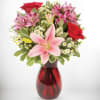 This is a stunning arrangement featuring a mix of vibrant flowers. It