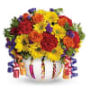 A frosted globe is decorated with birthday candles and filled with seasonal