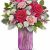 Very classy small arrangement . Hot pink Roses, mini white corn, pink