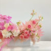 - Vibrant floral arrangement bursting with Barbie-inspired glamour
- Adorned with neon-bright pink