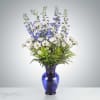 This tall blue and white arrangement is a breezy breath of summer