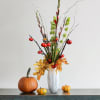 Mini pumpkins with red gladiolus green bells of Ireland and touches of