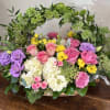 English garden basket filled with hydrangea, roses, ranunculus, lisianthus, snap dragons and