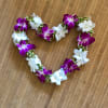 This lei has the beautiful leaf, Song of India, strung in between