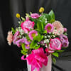 Assortment of Flowers With Pot and Bow