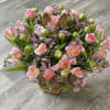 Easter Pink is a rabbit basket arrangement filled with pink tulips