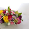 Keep things fun with this jewel toned flower box! Ranunculus, roses, and
