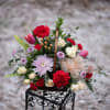 A basket filled with beautiful flowers for your loved one. Pretty cremons