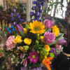 Roses, tulips, sunflowers, spray roses and delphinium make up this bouquet. Birthday