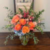 A mixed fresh cut consisting of Free Spirit Roses, Pink Snapdragons, Peach