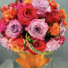 Glass bowl with submerged flowers and a full twist of summer bright