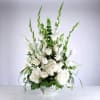 Beautiful arrangement with white roses, white flowers and greenery.