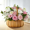 Beautiful arranged lisianthus, roses and stock in a woodchip basket. A sweet
