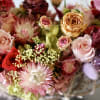 Elevate your living space with our exquisite, preserved flower arrangement, artfully presented