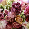 Elevate your living space with our exquisite, preserved flower arrangement, artfully presented