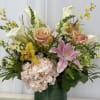 Like a gentle stroll through a sun-dappled meadow, this wildflower arrangement captures