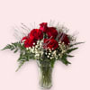 A classic red rose bouquet with a contemporary twist:
-Cluster of red roses
-Baby&#039;s