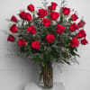 24 gorgeous and rich long-stem red roses, complete with greenery and design