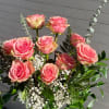 Romantic arrangement featuring one dozen premium cut roses paired with lush assorted