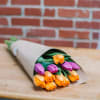 Wrapped tulip stems, perfect for bringing the spring indoors. Includes one dozen