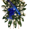 A white rose funeral spray is a poignant and elegant tribute, symbolizing