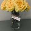 A cheerful bouquet of roses, delicately prepared and arranged in a medium