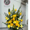 A sympathy pedestal arrangement offers a heartfelt expression of condolence, featuring a