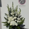 A sympathy pedestal arrangement offers a heartfelt expression of condolence, featuring a