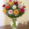 A dozen, 18, or 24 fresh roses arranged in a clear glass