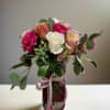 Experience the elegance of this stunning vase arrangement, showcasing soft shades of
