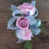 Cute as can be is this lavender/mauve spray rose wrist corsage with