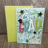 Full size greeting card. 
Front: Con-GRAD-ulations! You Did It!
Inside: You should be