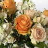 Peaceful and pure. This pretty arrangement of white and light colors will