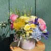 This arrangement stands in color and grace - bold, yet soft. A