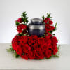 Pure red roses and greenery come together to create this beautiful urn