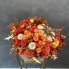 Flower mix in a pumpkin. Art piece that will bring fall mood