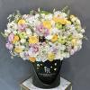 Festive arrangement of white flowers, fresh apples, and honey in our signature